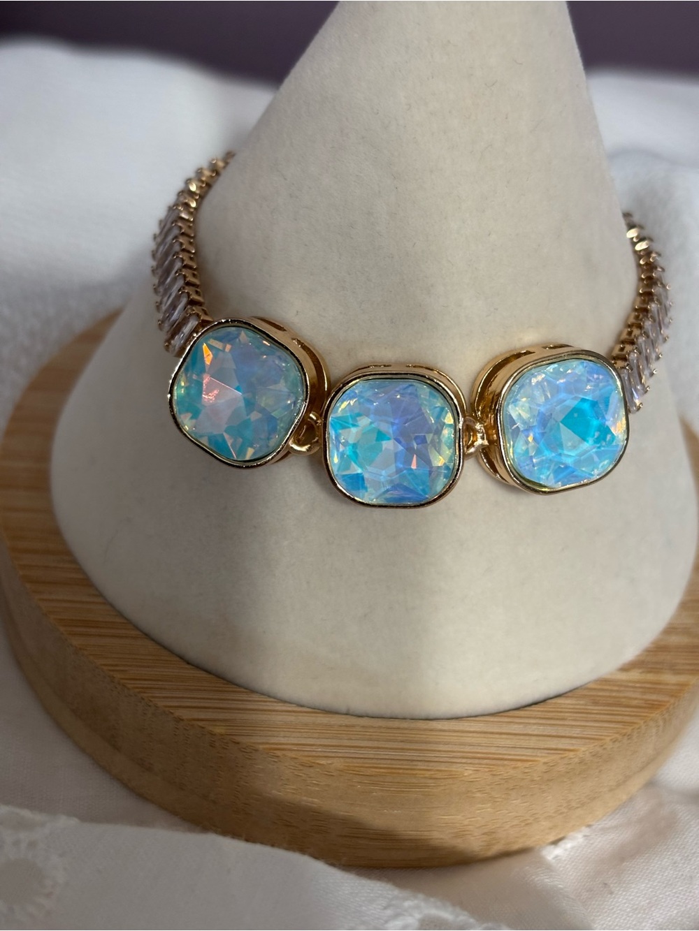 Gold Bracelet with Iridescent Blue Stones